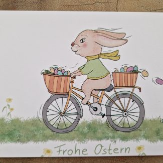 Postkarte Osterhase fährt Fahrrad